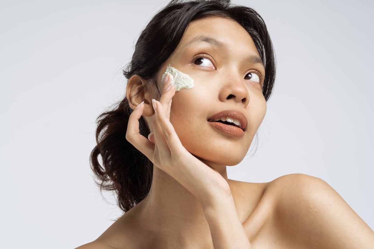 Woman Applying Facial Cream